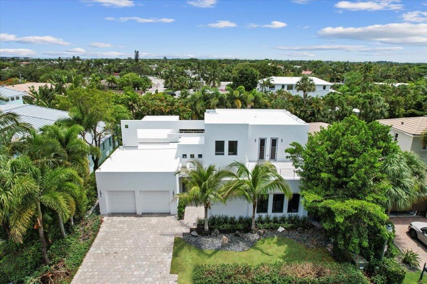 This newly designed modern home on one of SoSo's most exclusive streets, Palmetto Lane, is an entertainer's dream. Designed by Smith & Moore Architects and developed by Sam Fisch Development, this 4-bedroom, 3 full (and one half) bathroom residence has nearly 4,000 square feet of living space. Boasting dramatic, double-height ceilings in main living areas, and large format limestone flooring, the possibilities for entertaining are endless with its indoor/outdoor living centered around the courtyard pool. New marble countertops and backsplash make a statement in the kitchen, along with the Subzero and Wolf appliance packages, double Thermador oven, and separate bar area equipped with a wine cooler, ice maker, and plenty of space to entertain. The primary bedroom has some of the best views of the tropical pool oasis just outside. The main bathroom follows suit with his and hers sizable vanities, walk-in shower, and jet tub. Upstairs you'll find 3 additional bedrooms, with two rooftop patios for even more outdoor living.

Just a short walk away from the Intracoastal and its panoramic views, the conveniently located home is on an "A+" street in SoSo, east of Olive Ave, north of Forest Hill, south of Southern Blvd, and in the South Olive Elementary School district. It also has proximity to Lake Worth beaches, I-95, Flagler Drive bike path, Worth Avenue shopping, and fantastic dining. Not to mention just 3 minutes away is The Park, a brand new, full-range golf facility.