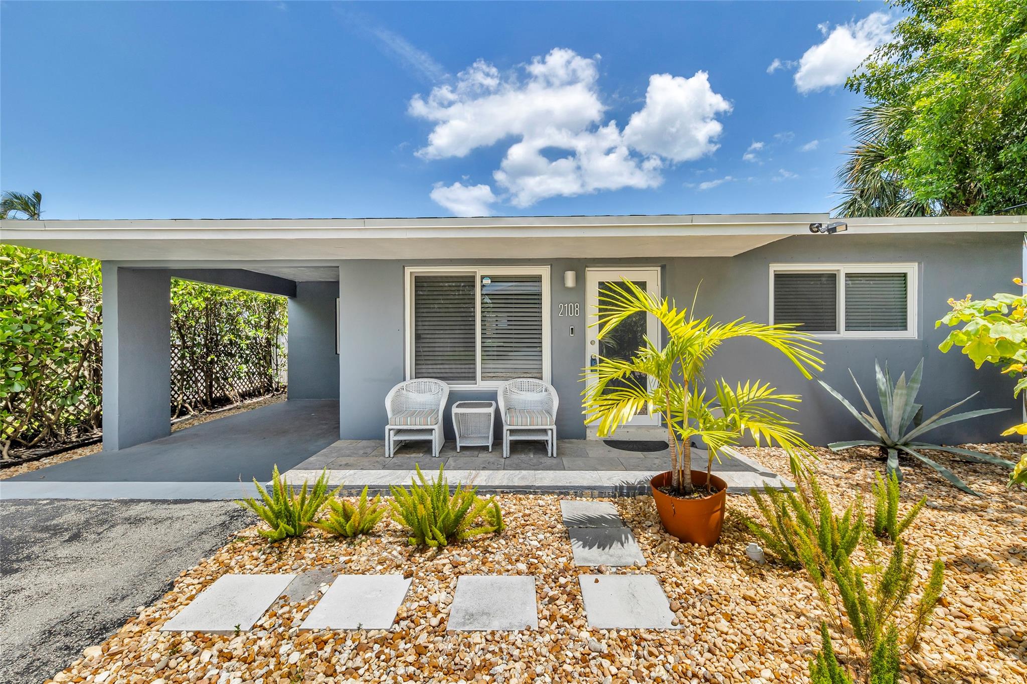 Looking for your weekend Get-Away in Wilton Manors? This precious house is just 2 blocks off Wilton Drive. Bathroom redone with high end products, such as Porcelanosa tile, Madeli bathroom vanity and mirror set, Toto toilet, and Grohe shower fixtures. Upgrades include new interior frosted glass panel doors, recessed LED lighting, new crown & baseboard molding, & new closet system build-out. No need to worry about any of the infrastructure - house has PVC sewer lines, rewired electrical throughout & upgraded electrical service to accommodate a future pool. Owner also installed an EV charging station in the carport. House protected by impact doors & windows, roof new in 2020, exterior lighting & RING systems front & back. Private setting, only 1 neighbor and nice relaxing vibe here!