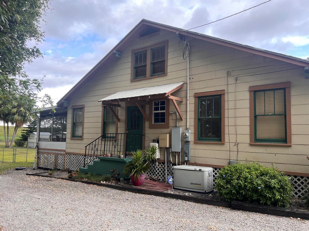 Photo of 1947 Bacom Point Road, Pahokee, FL 33476 (MLS # R11098457)