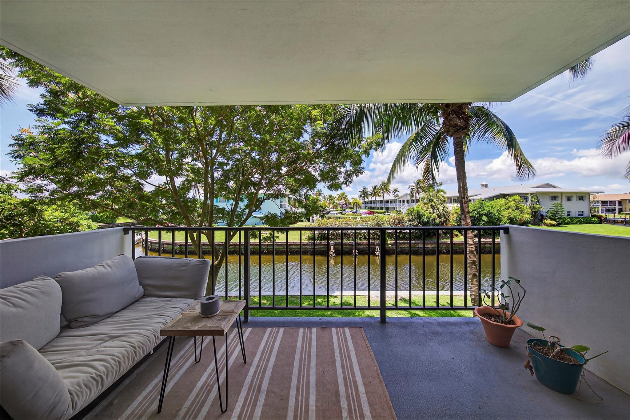 Beautifully renovated and professionally designed, this 1 bed, 1.5 bath unit in vibrant Pompano Beach is a must-see. Floor-to-ceiling windows showcase stunning water views and insane sunsets, creating a serene connection with nature. Relax on your private open balcony and take in the tranquility. The community features boat docks and resort-style amenities, including a new fitness center, pool, BBQ area, serenity pond, bike room and more. Live the ultimate South Florida lifestyle—just minutes from beaches, golf, tennis, pickleball as well as numerous shopping and dining options. Special assessment has been paid in full by seller, giving you financial peace of mind.
