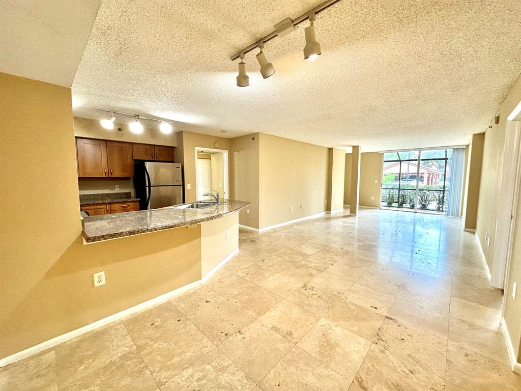 Beautiful 2/2 condo in Boca Raton, with a private entrance on the side of the building. An open floor plan with vaulted ceilings in the living room and saturnian marble floors. Open kitchen with granite countertops, spacious cabinets, stainless steel appliances and a breakfast area. In-unit laundry room. Two balconies with storage space. Master bathroom has two separate vanities with large counter space. The Master Bedroom has a multiple closet spaces including a walk-in closet, and a private balcony. 24/7 security guard gate. Clubhouse with billiard and piano, spa, fitness center, indoor racquetball, heated pool, tennis court, BBQ areas and playground. Pets are welcome! Is surrounded by A+ Schools. NEW CARPET IS BEING INSTALLED