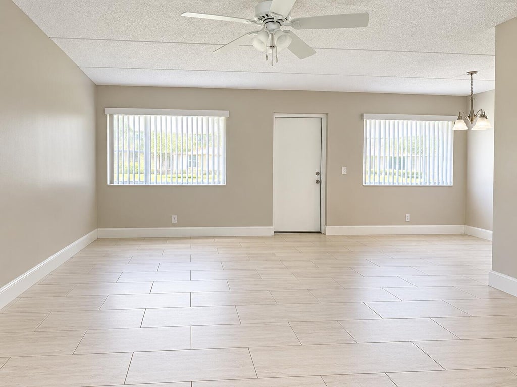 Photo of 100 Village Green Circle E #112, Palm Springs, FL 33461 (MLS # B26093572)