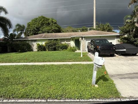 Photo of 203 Canterbury Drive W, Riviera Beach, FL 33407 (MLS # R11127949)