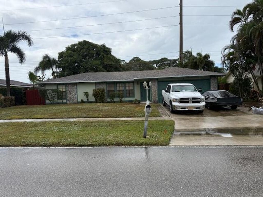 Photo of 203 Canterbury Drive W, Riviera Beach, FL 33407 (MLS # R11127949)
