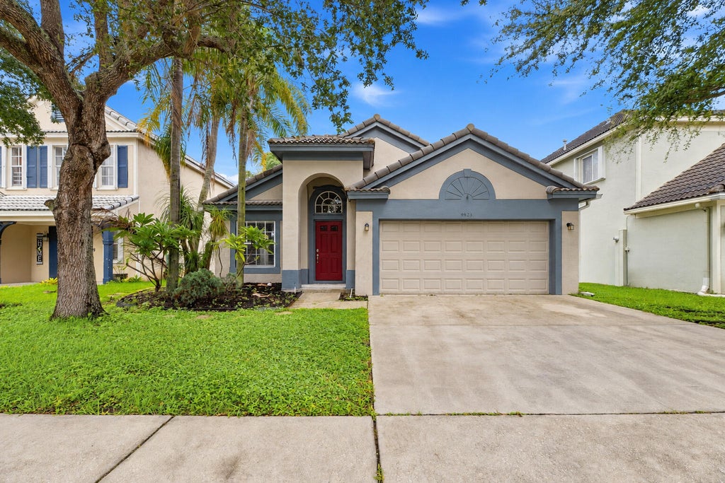 Photo of 9823 N Grand Duke Circle, Tamarac, FL 33321 (MLS # B26080379)