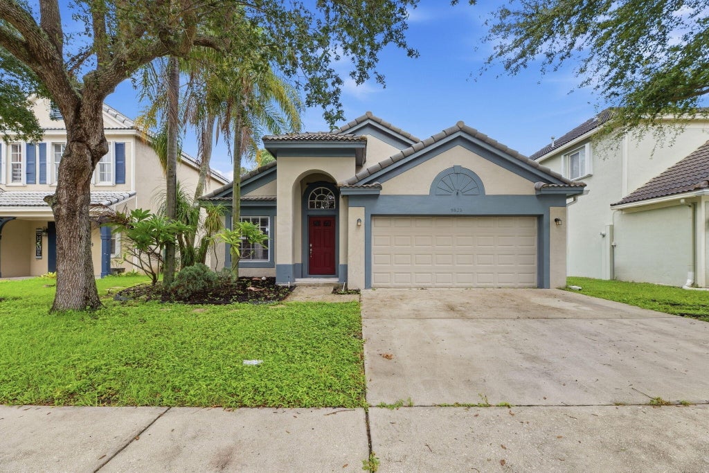 Photo of 9823 N Grand Duke Circle, Tamarac, FL 33321 (MLS # B26080379)