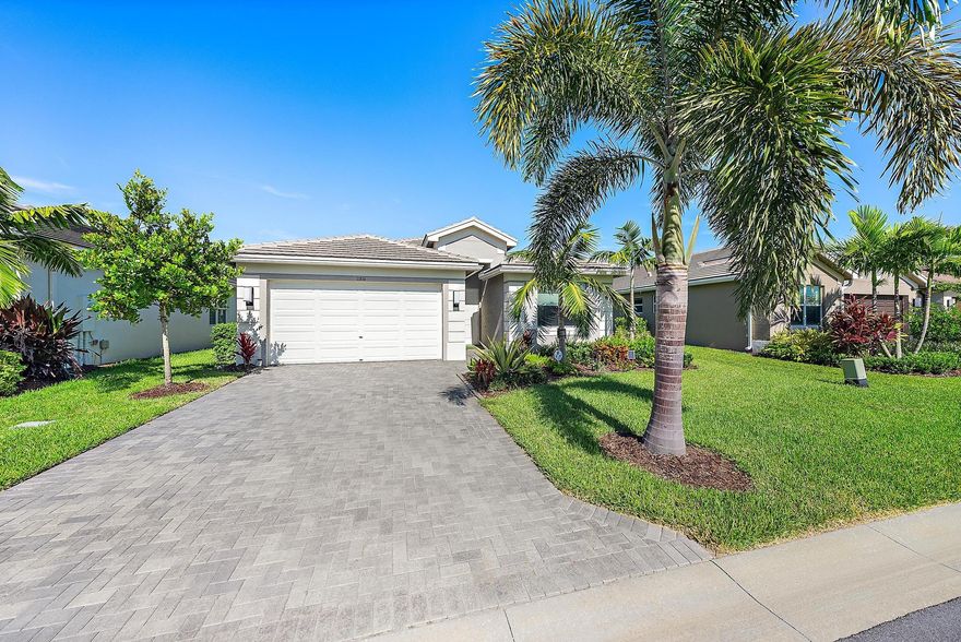 Enjoy the waterfront views in this 2023 Osprey model - The light and bright interior features 3 beds/2 baths with ultra modern finishes and sleek upgrades throughout. Kitchen features all quartz counters, stainless steel appliances, reverse osmosis system, custom cabinets with upgraded hardware, along with a large breakfast bar. Master suite includes custom built out walk in closet. Relax on the oversized lanai completely enclosed overlooking the lake view. Epoxy coating in garage. Hurricane impact windows. Washer/ dryer included. Valencia Grove is one of the most active 55+ communities with no shortage of activities! Amenities include lawn care/sprinklers, fitness center, art & culture center, pickleball & tennis courts, cafe, indoor pool & spa, walking trails, theatre and more.