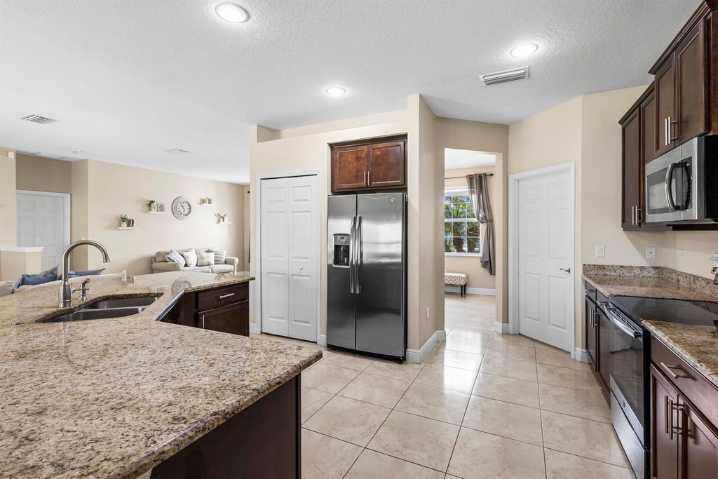 Photo of 1571 SW Apricot Road, Port Saint Lucie, FL 34953 (MLS # R10994530)