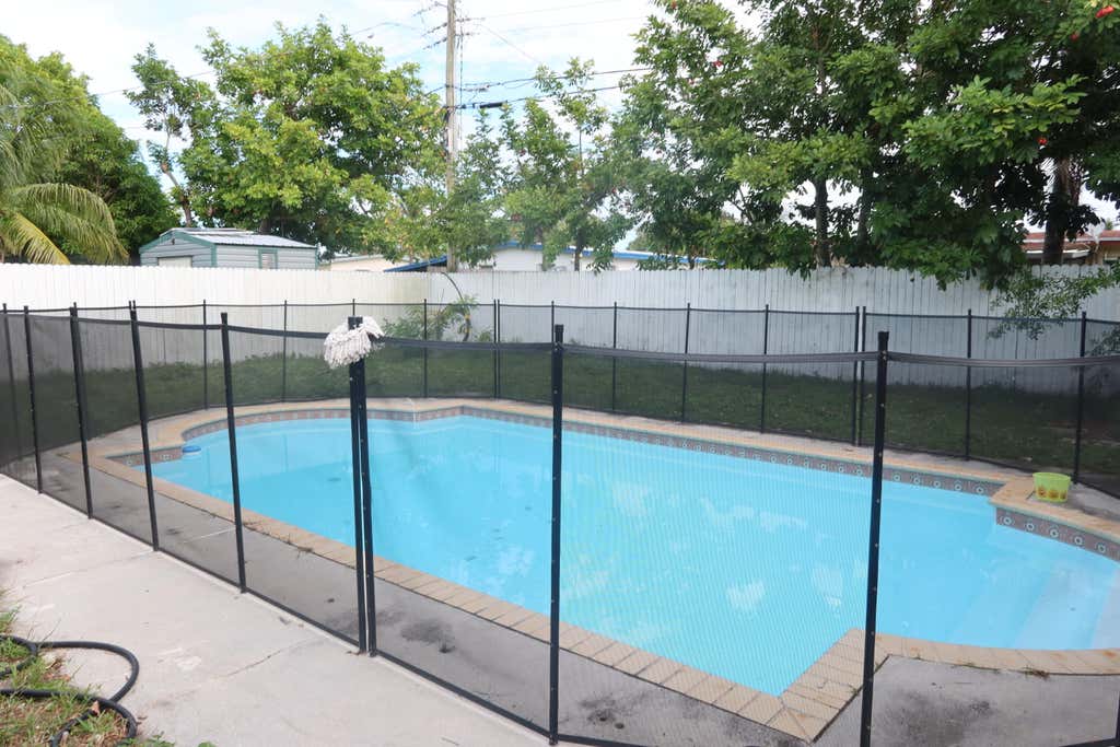 Photo of 1751 LAUDERDALE MANOR Drive, Fort Lauderdale, FL 33311 (MLS # B26057080)