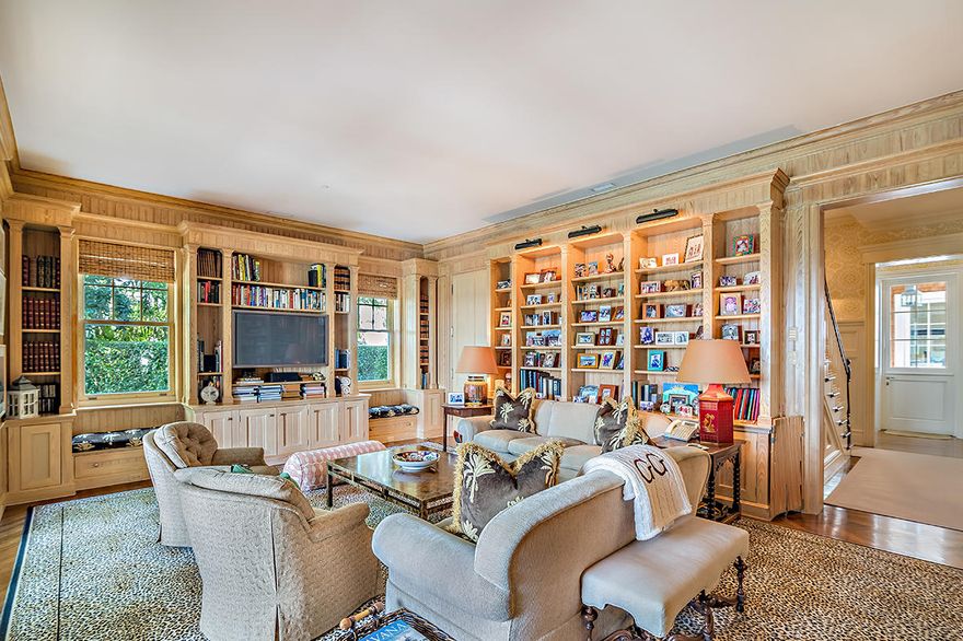 Built in 2003 to the highest standards, this impressive lakefront estate is characterized by high ceilings, deep overhangs, large porches, and numerous windows taking in spectacular Intracoastal Waterway and sunset views. Perfect for entertaining, the grand two-story living room has a soaring gabled ceiling with wooden beams and elegant details.