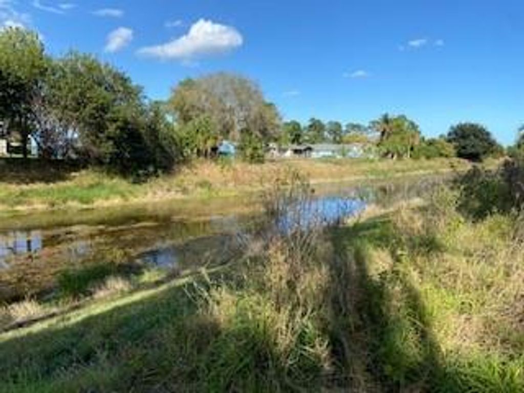 Photo of 1133 SW Ackard Ave, Port Saint Lucie, FL 34953 (MLS # F10321474)