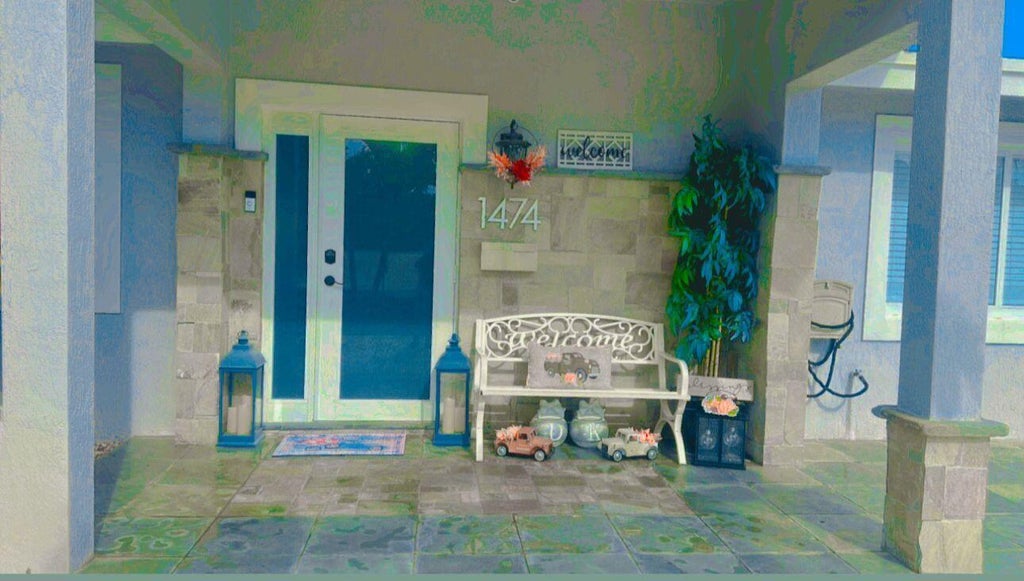 Photo of 1474 Cochran Drive, Lake Worth Beach, FL 33461 (MLS # B26079798)