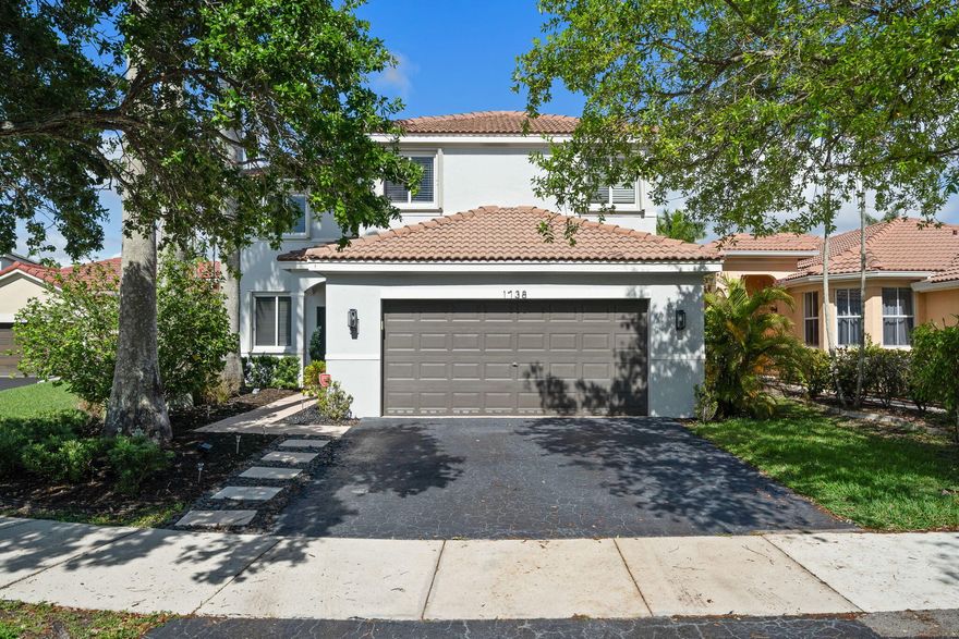 Tucked within the vibrant community of Savanna, this home invites you into a lifestyle where every detail has already been thoughtfully elevated. From the moment you step inside, there's a sense of ease—open spaces, natural flow, and finishes that feel both modern and welcoming.  At the heart of the home, a beautifully updated 2019 kitchen with sleek quartz countertops becomes the natural gathering place, seamlessly connecting everyday living with moments of entertaining. Vinyl flooring (2019) carries you throughout, while the renovated bathrooms reflect a clean, contemporary design. Beyond aesthetics, comfort meets peace of mind with impact windows and doors, offering security, efficiency, and quiet confidence year-round.  Step outside and the experience continues, an oversized, fenced backyard, private and covered patio create the perfect setting for relaxed evenings or lively weekends with family and friends. All of this, set in Weston, where top-rated schools and resort-style amenities complete the picture. This is not just a home, it's where everyday living feels elevated.
