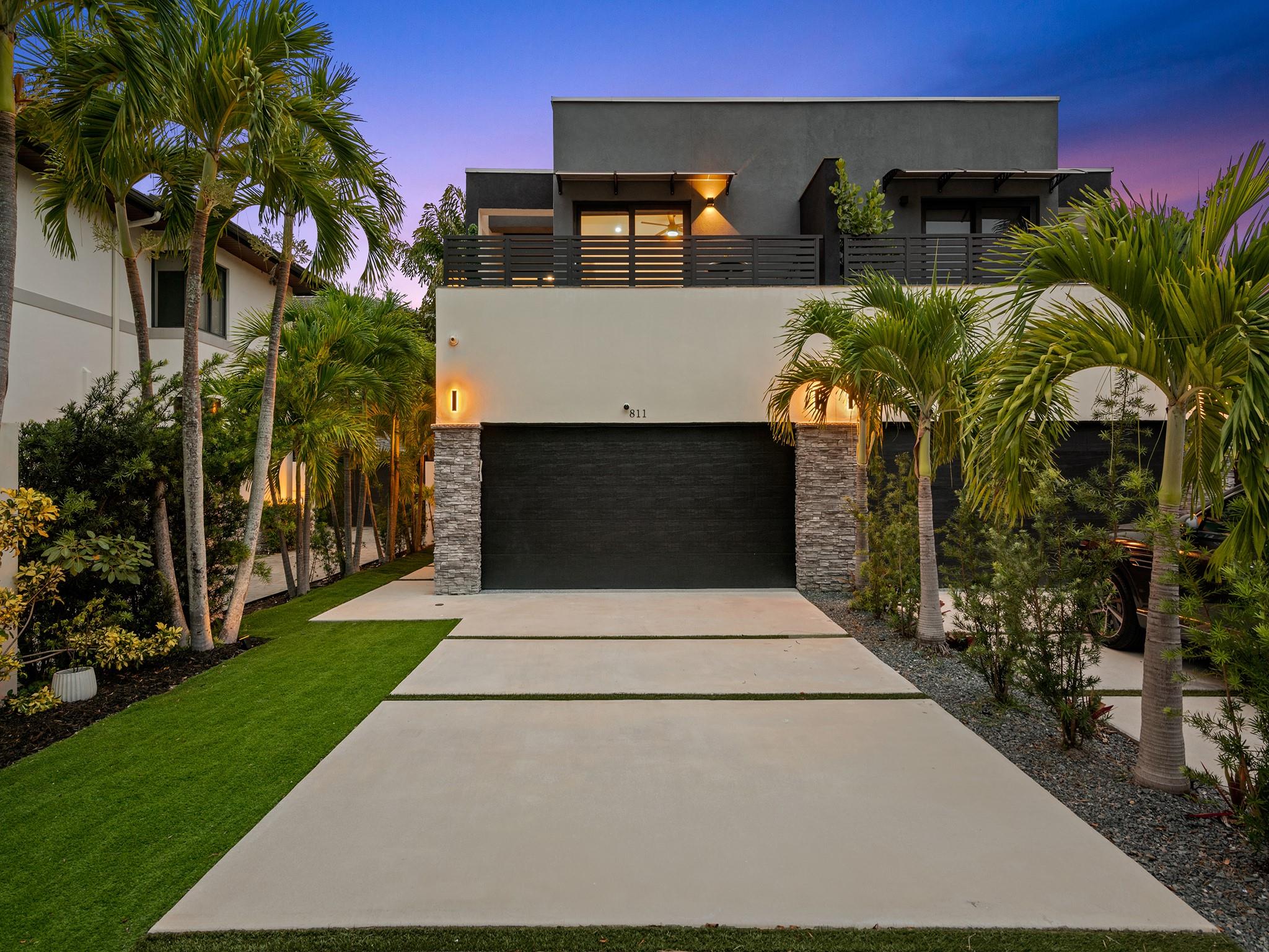 Tucked away at the confluence of 10th Street & the Tarpon River, this exquisite 3/2.5 townhome, completed in 2023 offers contemporary luxury & timeless design. NO HOA FEES. Situated in a serene neighborhood less than a mile from the heart of downtown Ft Lauderdale & iconic Las Olas Boulevard, this Fee Simple residence is a true gem. Soaring ceilings & vaulted kitchen windows reveal mature foliage & bathe the open-concept living space in natural light, highlighting custom cabinetry, refined architectural details, & sleek modern lines. Outside is perfect for entertaining with built-in summer kitchen island & artificial turf for easy maintenance. A spacious 2-car garage is complemented by additional parking for up to four vehicles, making this an exceptional offering in both form & function.
