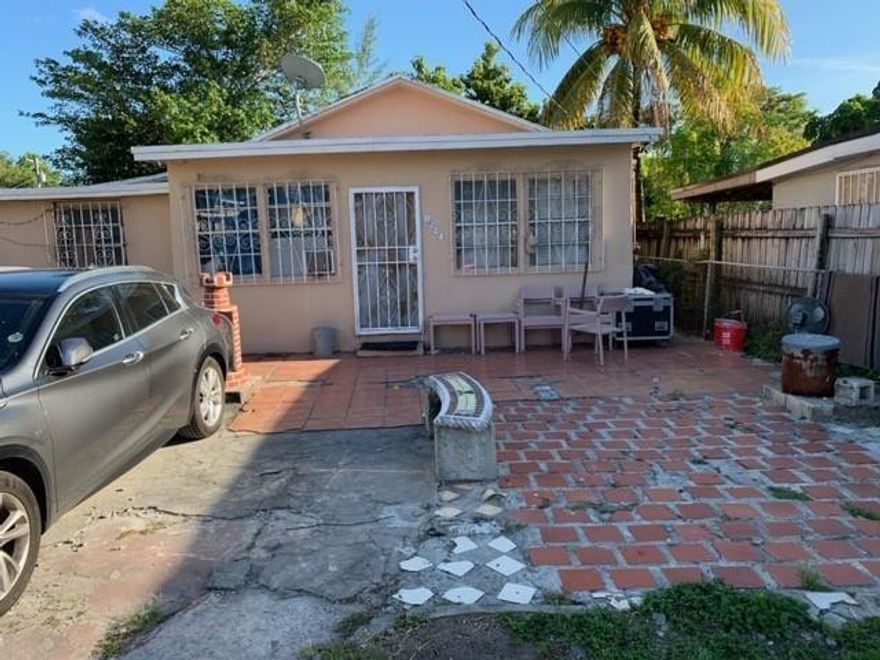 Home is located near the airport and is gated. It has an efficiency in the back and the building could be transformed into a multi family building. NO HOA, bring your boat, RV's, dogs, no restrictions.