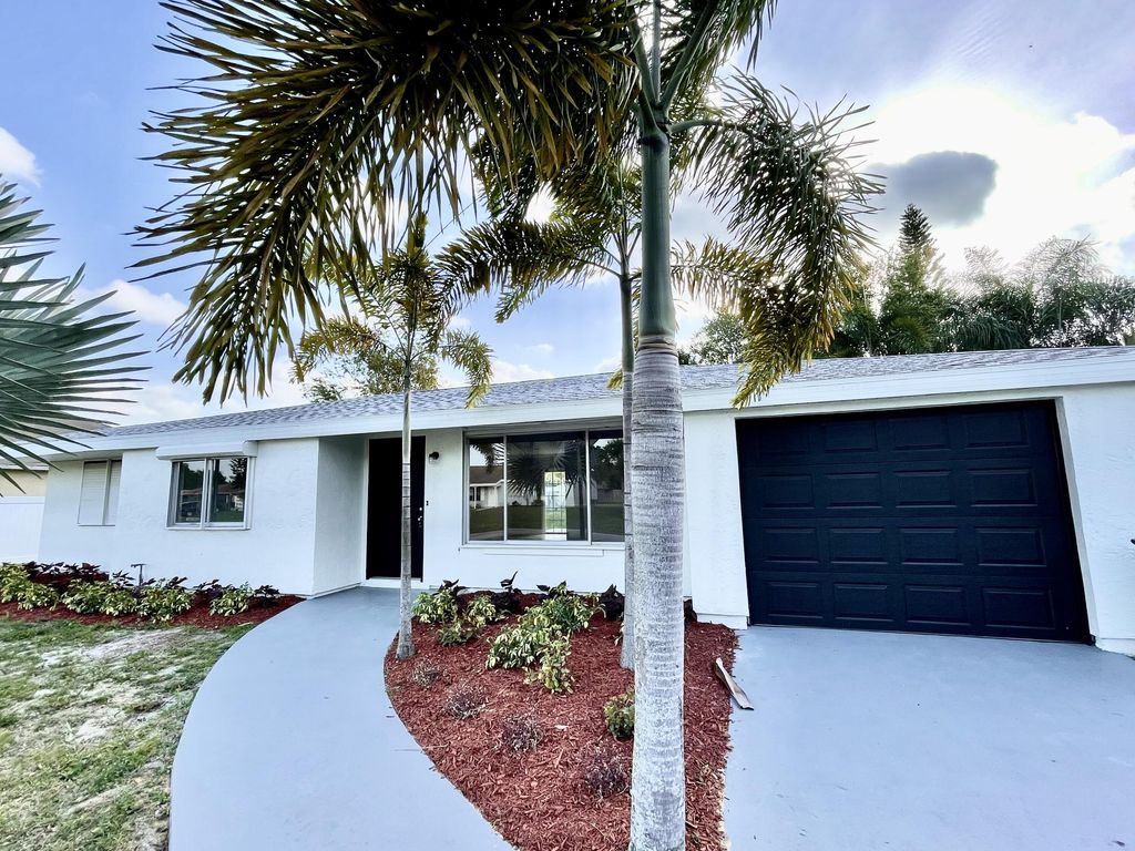 Photo of 225 SW Homeland Road, Port Saint Lucie, FL 34953 (MLS # R10797432)