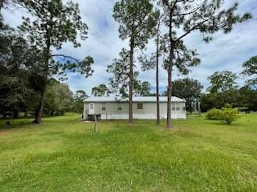 Looking for a serene retreat? This is it! 2.5+/- acres, gated and completely fenced, 3-bedroom, 2 two-bath   home. The property is currently NOT IN A FLOOD ZONE, and is zoned rural residential which allows for livestock, and horses! This is a great community with plenty of trails & dirt roads for horseback riding and all of the other outdoor activities that you love; tack room with 2 horse stables. The home features a metal roof, installed in 2018. New outside electrical panel accomodates a generator on or off switch. All plumbing recently redone within the past 2 years. Newer HVAC system. The property is approximately a 2-hour drive from Miami / Ft. Lauderdale or about an hour from Ft. Myers. Appliances: Washer, electric range, refrigerator, ceiling fans. Roof installed in 2018.