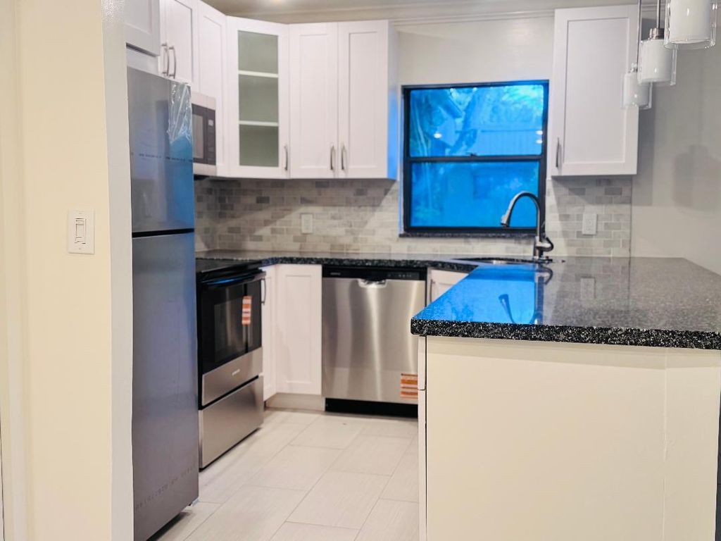 Photo of 8901 N New River Canal Road #17w, Plantation, FL 33324 (MLS # B26020373)