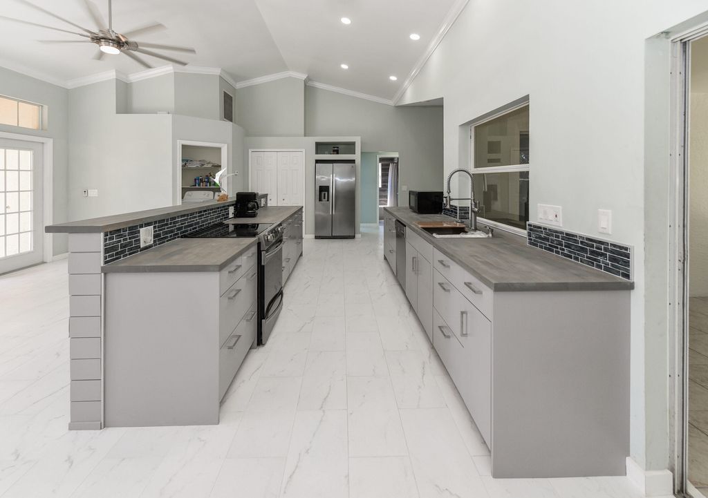 Photo of 130 SW Tulip Boulevard, Port Saint Lucie, FL 34953 (MLS # R10967344)