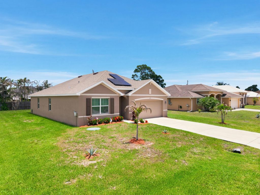 Photo of 1771 SW Lofgren Avenue, Port Saint Lucie, FL 34953 (MLS # B26044928)