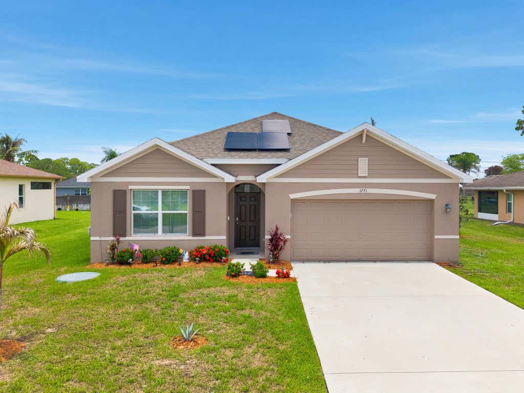 Photo of 1771 SW Lofgren Avenue, Port Saint Lucie, FL 34953 (MLS # B26044928)