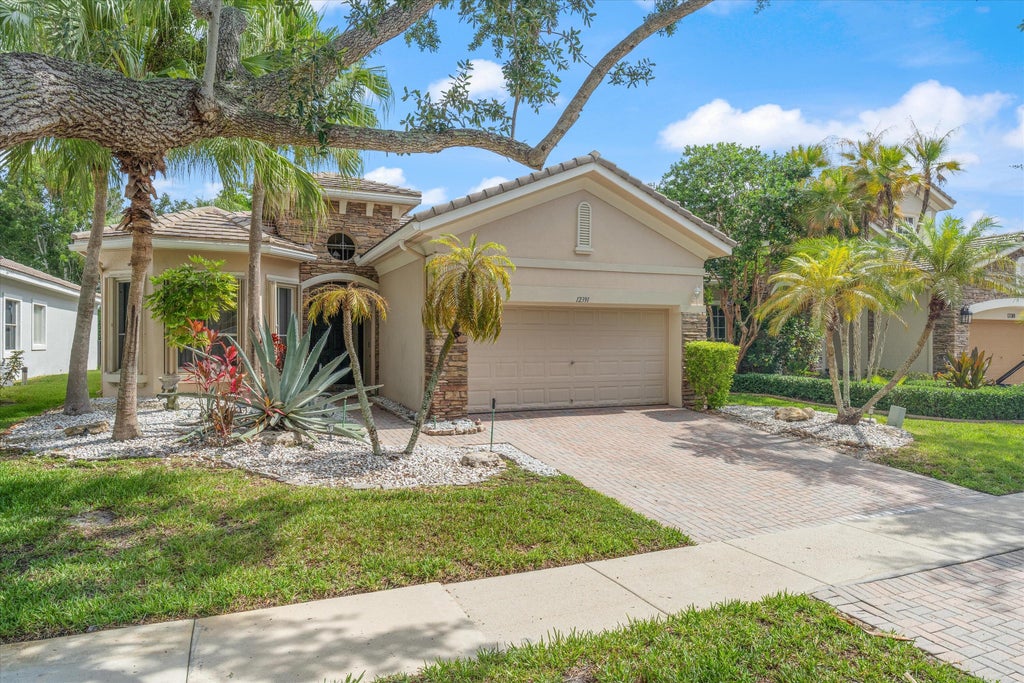 Photo of 12391 NW 78th Manor NW, Parkland, FL 33076 (MLS # B26044560)