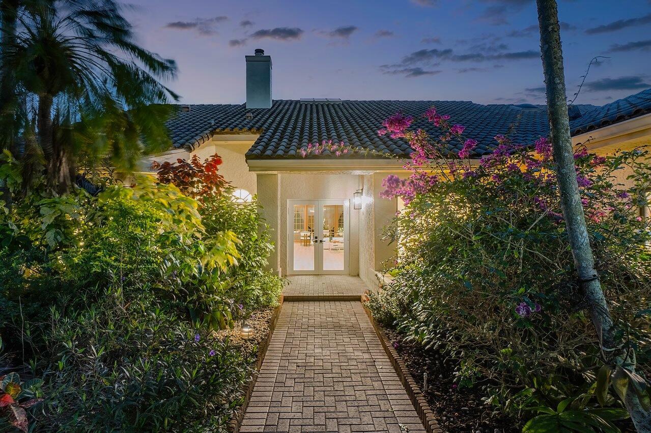 Nestled in highly desirable Bristol, this exquisite residence will captivate with awe-inspiring golf and water views set against breathtaking Florida sunsets. The remodeled interior offers 3 en-suite bedrooms, a den/optional 4th bedroom, and a powder room across 2938 sqft. Step inside to a palatial great room adorned with vaulted ceilings and sun-filled French doors, leading to a luxurious new pool and patio. The gourmet kitchen features custom Italian cabinetry, Caesarstone countertops and stainless steel appliances. Other notable upgrades include contemporary designer fixtures, recessed LED lighting, beautiful hardwood flooring throughout the living spaces, premium carpeting in the bedrooms, a two-car plus golf cart garage, and so much more. A rare gem in Hunters Run.