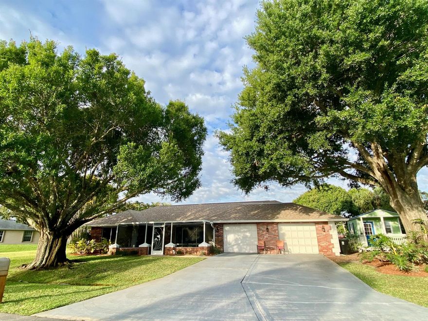 Owner's downsizing after 28 years (only 2nd owner) of this fabulous multi-generational home with a large mother-n-law apartment. You'll love the 4 sets of sliders that opens to enclosed back patio w/heated, salt water pool and free standing  therapeutic jacuzzi or enjoy  your coffee on the screened in front lanai. Home offers spacious rooms throughout along with a new roof, new she shed, hurricane shutters and everything you could want in a desirable neighborhood in Sandpiper Bay area. BONUS: New air conditioned finished off she shed is perfect for office, art studio or play house.
You can't beat the convenient location... only 5 minutes from all your shopping needs, the  PSL hospital and only 15 minutes from the Beach, Stuart, Jensen Beach, Ft. Pierce or Tradition... Centrally Located!