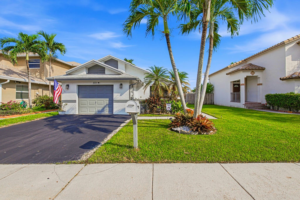 Photo of 501 Lakeside Circle, Sunrise, FL 33326 (MLS # B26086187)