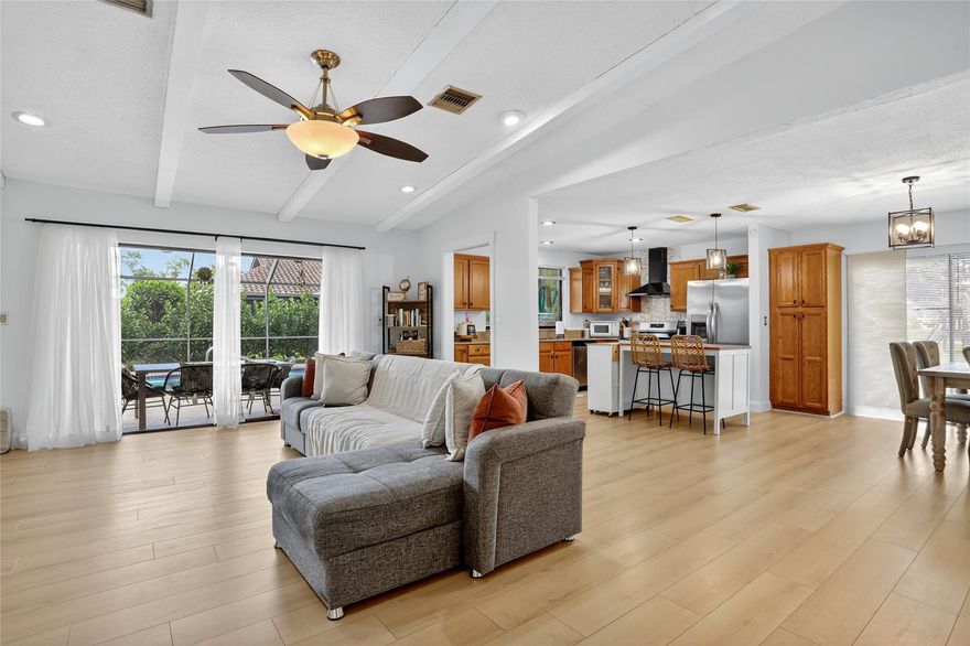 This one’s got that feel-good energy. Tucked in The Woodlands—Tamarac’s hidden gem—this 3-bed, 2-bath beauty has been thoughtfully updated with the kind of style that feels both effortless and elevated. The kitchen flows into a bright, open living space with vaulted ceilings and fresh finishes that make every day feel a little more special. Slide open those doors and you’ve got your very own screened-in pool, ready for morning swims or dinner al fresco. The primary suite is your calm retreat, with a timeless walk-in shower and dual vanities. Two more spacious bedrooms flex for whatever you need - sleep, work or play. It’s charm, comfort, and ease—wrapped into one inviting home.