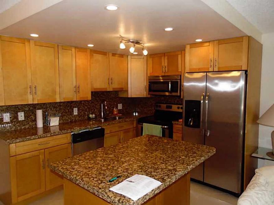 FURNISHED, OPEN KITCHEN WITH ISLAND, NEW EVERYTHING!! TOP OF THE LINE APPLIANCES, GRANITE COUNTER TOPS IN KITCHEN AND BATHROOMS...LOVELY CERAMIC TILES THROUGH OUT! ASSOCIATION CLAIMS 55+