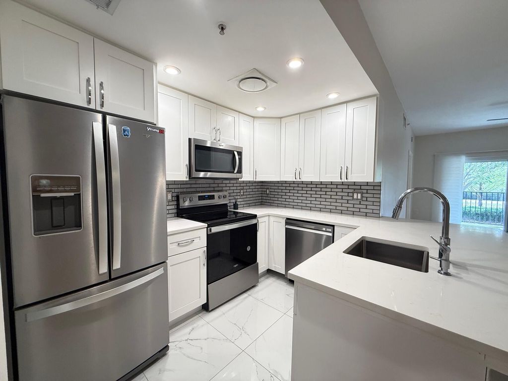 Photo of 5860 W Sample Rd #202, Coral Springs, FL 33067 (MLS # B26000472)