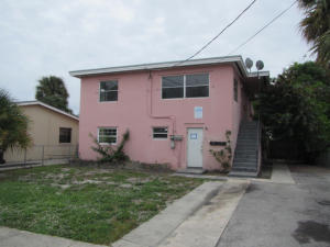Triplex located in downtown West Palm Beach. The two units on the lower level each have two bedrooms and one bathroom. The upper level unit has two entrances and and houses three bedrooms and two bathrooms.