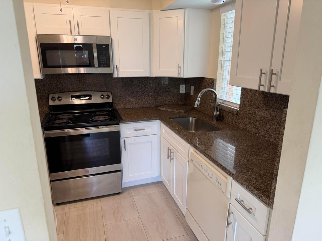 Photo of 1512 SE ROYAL GREEN Circle #203, Port Saint Lucie, FL 34952 (MLS # B26071127)