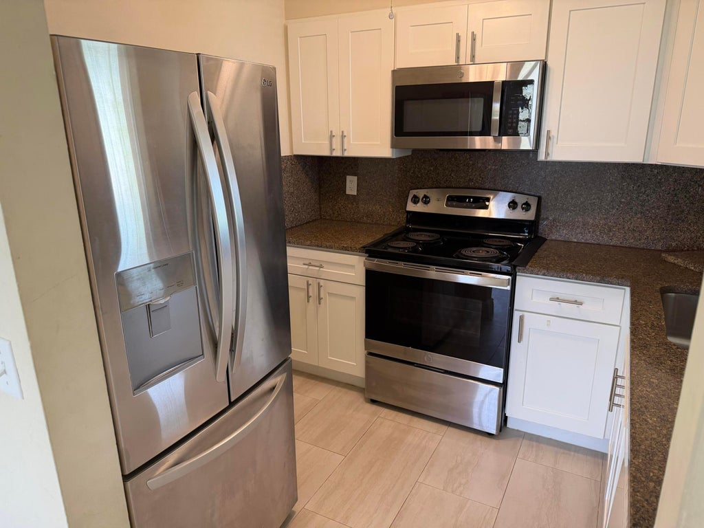 Photo of 1512 SE ROYAL GREEN Circle #203, Port Saint Lucie, FL 34952 (MLS # B26071127)