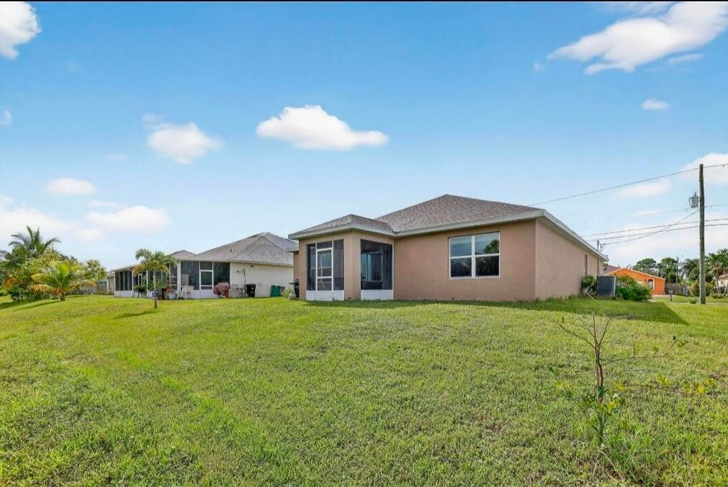 Photo of 543 SW Whitmore Drive, Port Saint Lucie, FL 34984 (MLS # B26016161)