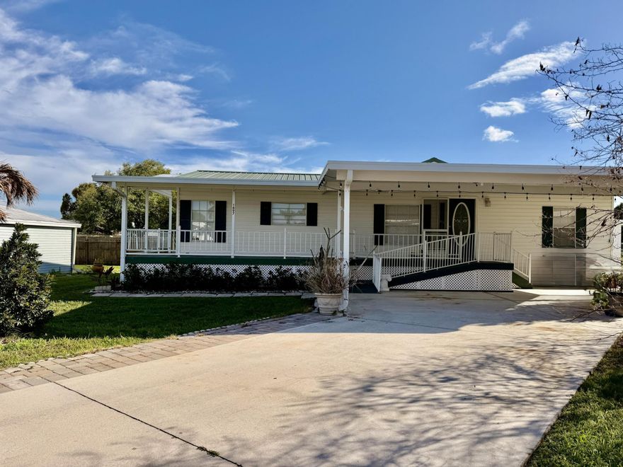 SEMINOLE COVE SENSATION! Beautifully updated 3 Bd/ 2 Ba -Top Notch -HOMES OF MERIT. Lovely open concept and split plan. NEW LVP flooring throughout. NEW white Shaker cabinets with brushed gold hardware. Granite counters, Pantry and NEW appliances.  Sweet breakfast nook. Master suite has separate shower and soaking tub. Covered front porch with ramp and steps. 1296 SF under air- 2157 TLA. Storage Room. 2023 HVAC, Metal Roof. Covered parking. Perfection on a cul-de-sac! This HAPPY HOME Awaits YOU!  Dimensions are approximate, must measure for exact.