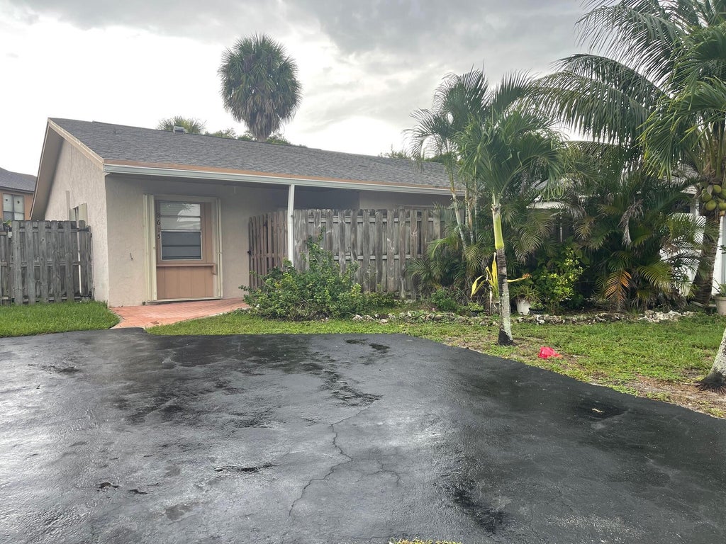 Photo of 8615 Satalite Terrace, Lake Park, FL 33403 (MLS # B26075363)