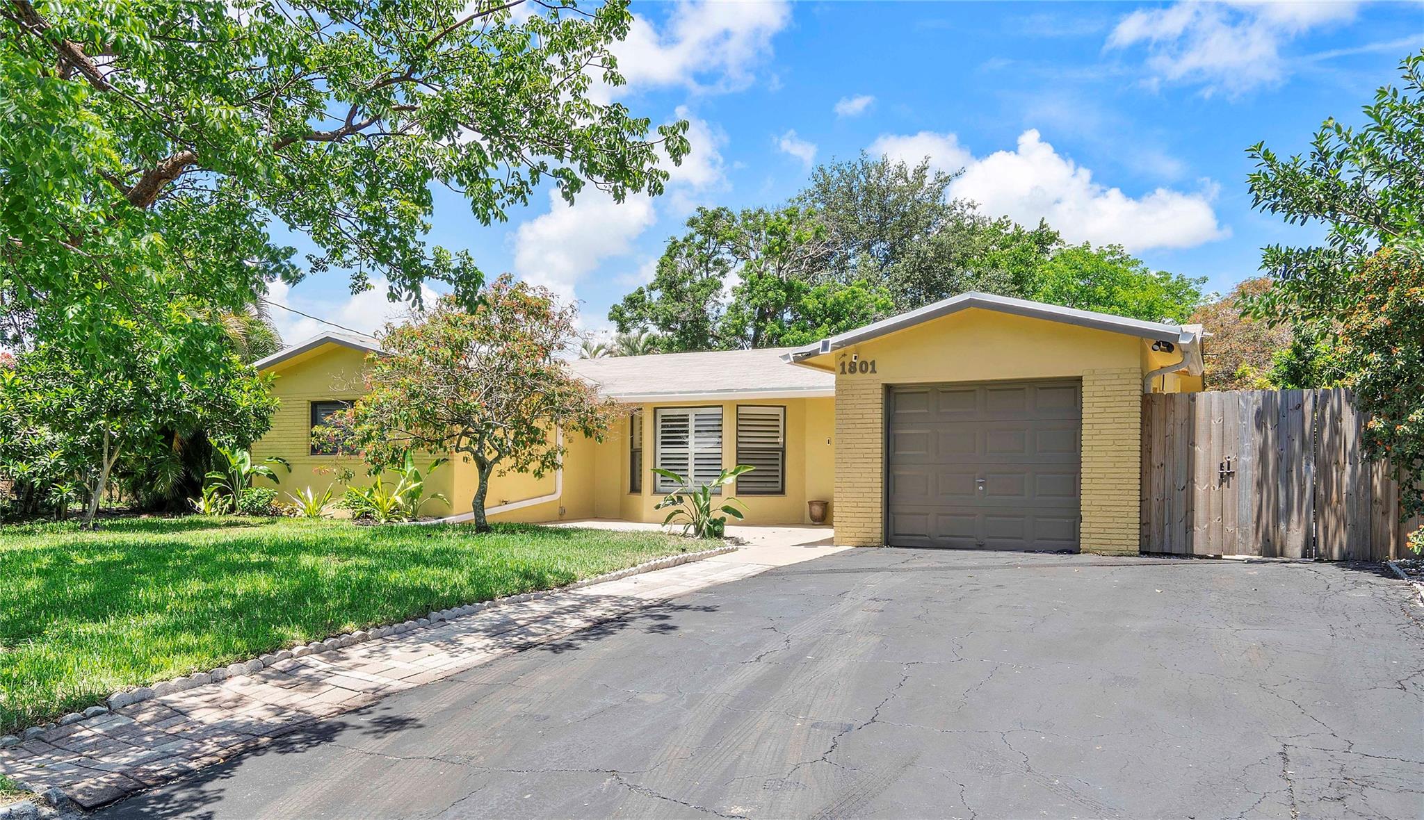 Beautifully updated & lovingly maintained, this FLORANADA School District home shines with quality. The kitchen has been fully updated with quartz countertops, a farmhouse sink, sleek cabinetry, stainless steel appliances, & added windows. Bedrooms include blackout blinds, plantation shutters, & ceiling fans for added comfort. Step out to the large screened-in patio with travertine floors. The oversized yard includes a storage shed & 12' gate for RV/BOAT PARKING! Laundry room off kitchen leads to a 1-car garage with a split AC, metal shelving & work station. Other updates include refinished terrazzo floors, exterior & interior paint, impact windows, roof (2020), smart & solar lighting, & RO water filter. Preferred to be rented furnished but that is somewhat negotiable.
