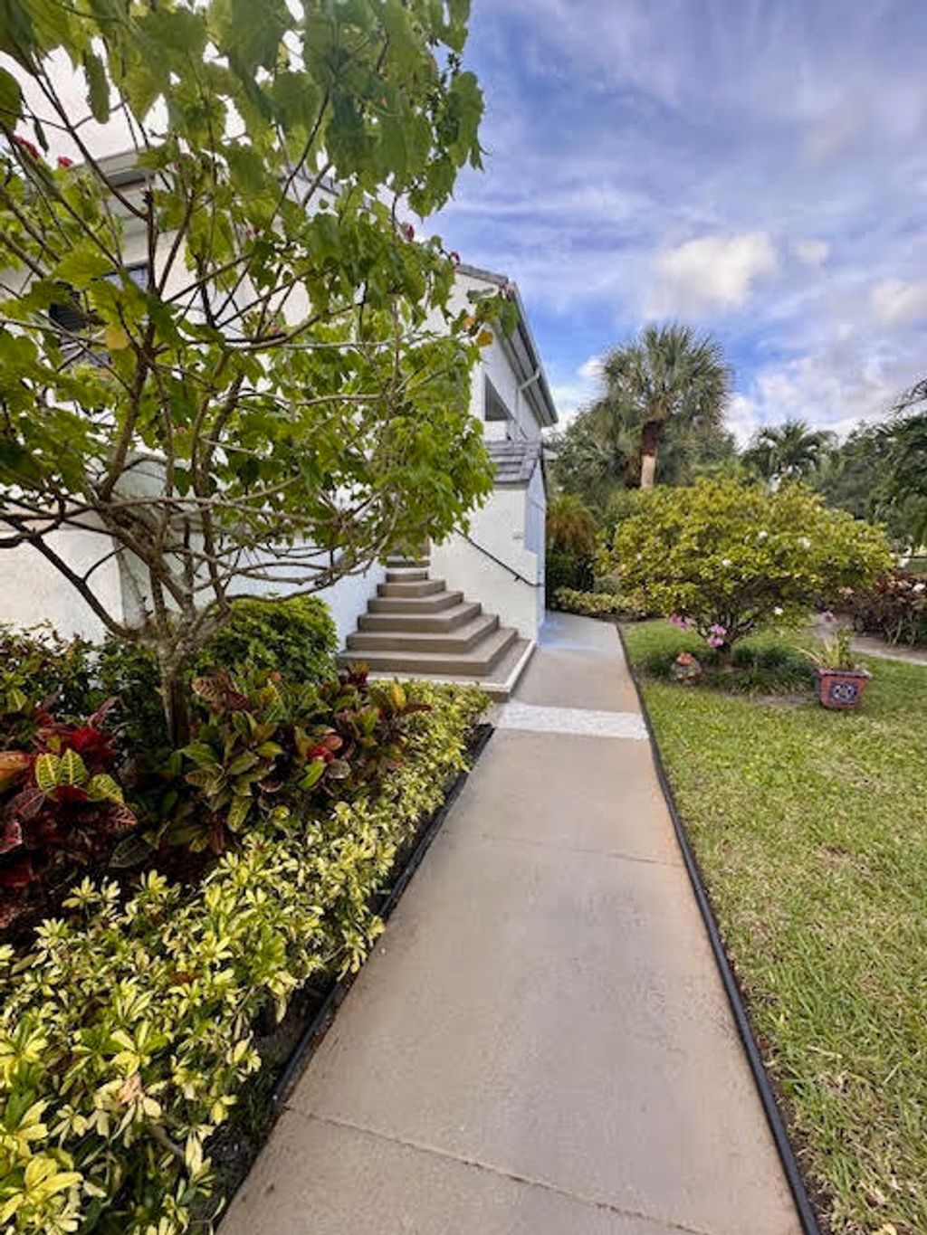Photo of 7449 Glendevon Lane #104, Delray Beach, FL 33446 (MLS # B26017511)