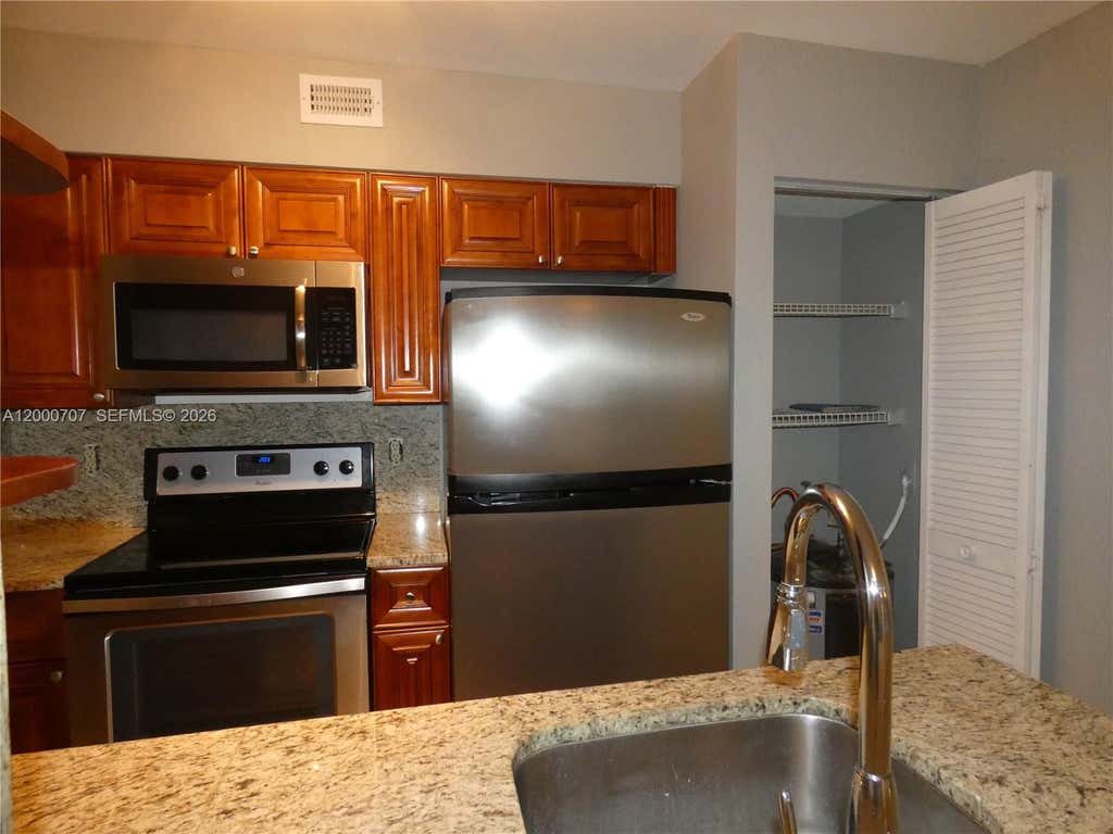 Photo of 2841 N Oakland Forest Drive #207, Oakland Park, FL 33309 (MLS # A12000707)