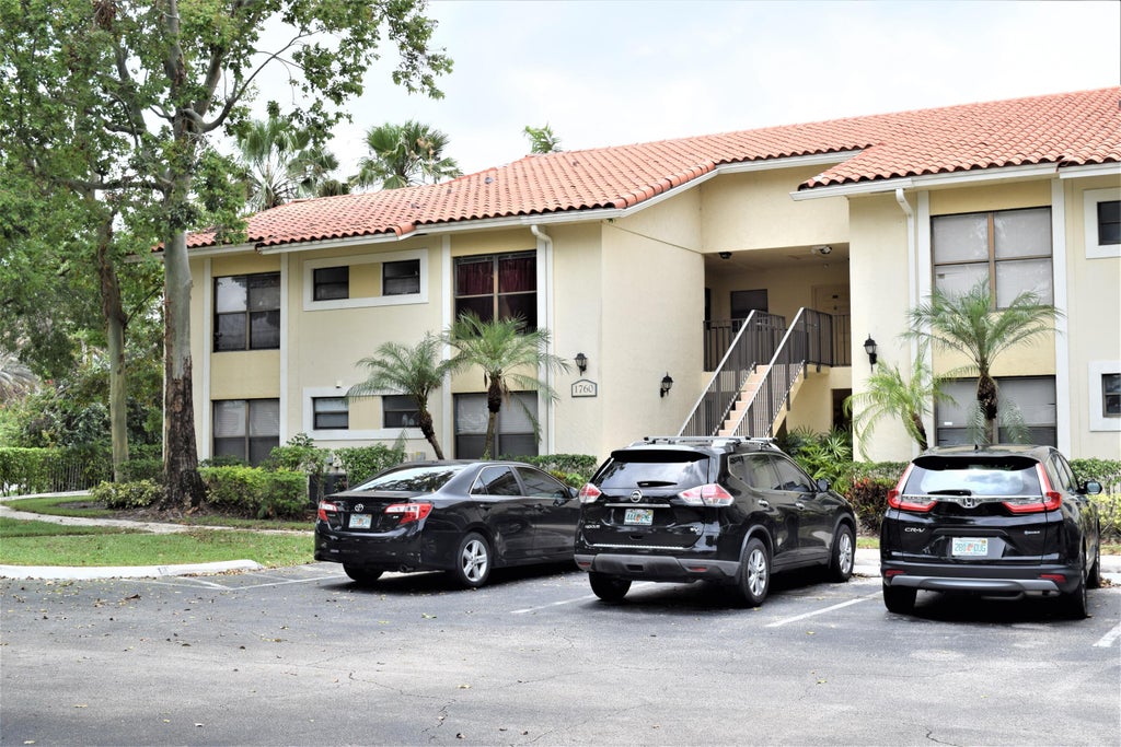Photo of 1760 WINDORAH Way #F, West Palm Beach, FL 33411 (MLS # B26076452)