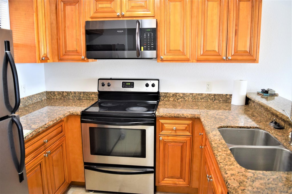Photo of 1760 WINDORAH Way #F, West Palm Beach, FL 33411 (MLS # B26076452)