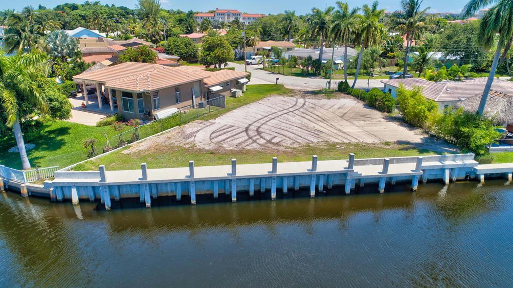 NESTLED IN BOCA ISLANDS, ONE OF BOCA RATON'S MOST EXCLUSIVE WATER FRONT COMMUNITIES, IS THIS BUILDER'S DREAM LOT WITH OVER $200K VALUE OF MAJOR SITE IMPROVEMENTS! THIS KEY LOT HAS 110FT OF WATER FRONTAGE WHICH MEANS IT HAS 30FT MORE WATERFRONT THAN THE STANDARD BOCA ISLANDS LOT. THIS KEY LOT BOASTS 110FT OF NEW STATE OF THE ART CONCRETE SEAWALL AND 80FT OF NEW STATE OF THE ART CONCRETE DOCK. THE ENTIRE LOT IS OF RAISED ELEVATION WITH NEW CONCRETE RETAINING WALL & COMPACTED FILL THAT HAS BEEN TESTED AND APPROVED BY NUTTING ENGINEERS AS READY TO BUILD! PLANS FOR A NEW 5BR, 4.5 BATH HOME ARE AVAILABLE! BEAUTIFUL VIEWS WITH OCEAN ACCESS VIA FIXED BRIDGE FOR BOATS ANY LENGTH BY 8' HIGH OR LESS!