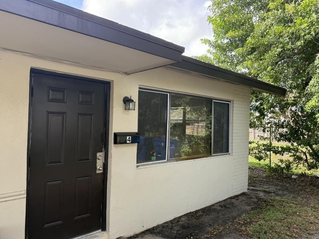 Photo of 1150 W Blue Heron Blvd #4, Riviera Beach, FL 33404 (MLS # R11148652)