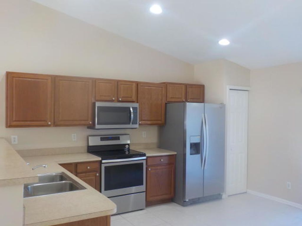 Photo of 3562 SW Dellamano Street, Port Saint Lucie, FL 34953 (MLS # R10956954)