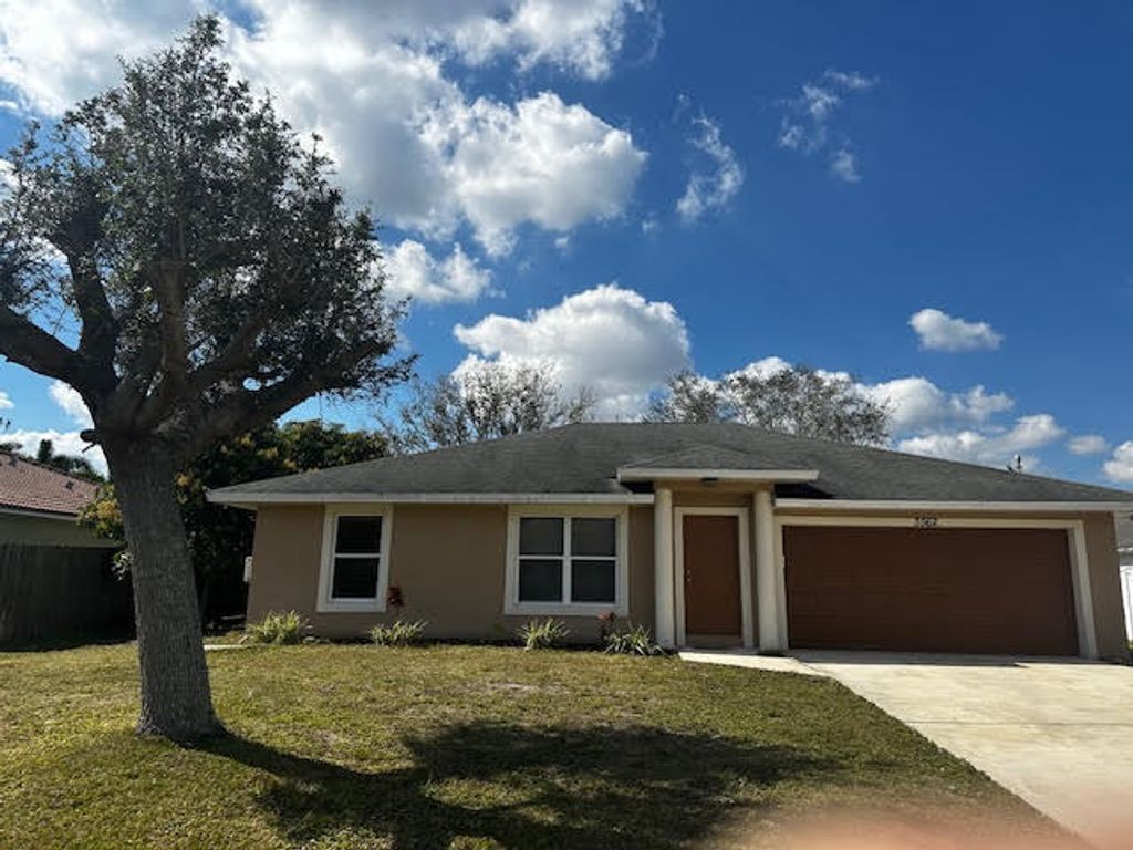 Photo of 3562 SW Dellamano Street, Port Saint Lucie, FL 34953 (MLS # R10956954)