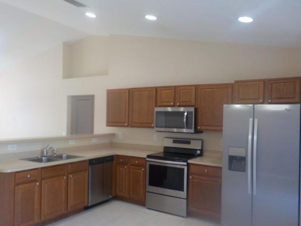 Photo of 3562 SW Dellamano Street, Port Saint Lucie, FL 34953 (MLS # R10956954)