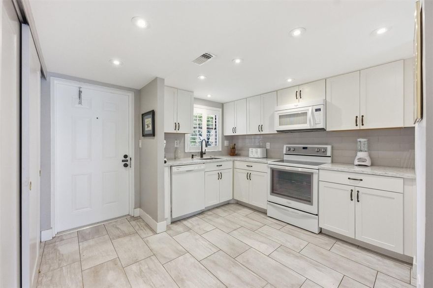 BEST PRICED RENOVATED CONDO IN SUNRISE LAKES!! Stunning first-floor waterfront 2-bedroom, 2-bath residence located in the highly desirable Sunrise Lakes Phase III, beautifully upgraded throughout. This inviting home features a renovated kitchen with custom cabinetry and sleek granite countertops, complemented by elegant tile flooring in every room. Enjoy the added charm of plantation shutters and relax on your screened patio while taking in serene, picturesque water views. Includes a tankless water heater and NEW AC for comfort and efficiency. A vibrant 55+ lifestyle with exceptional amenities, indoor and outdoor swimming pools, a clubhouse, Galaxy Theater, fitness center, billiard rooms, and an active social calendar. Conveniently located near Sawgrass Mills, dining, and entertainment. This is a 55+ community. Phase 3 has no reserves. The association requires a minimum net monthly income of $3,250 and a minimum credit score of 670 or higher.