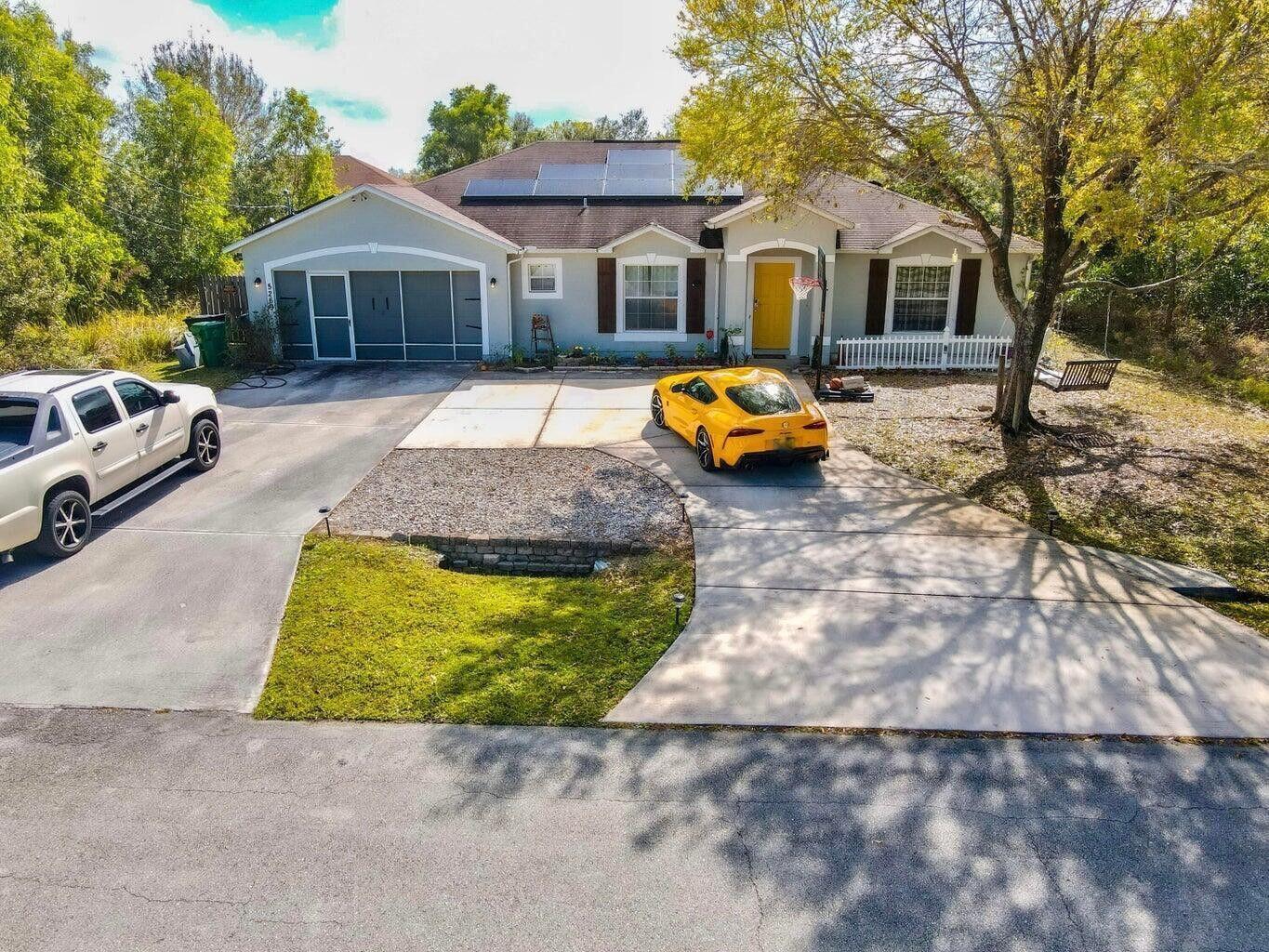 WOW! Check out this beautiful 4 bedroom home located in Port St Lucie. Very spacious with vaulted ceilings, split floor plan. This house features a huge fenced in yard, close to everything! Plenty of parking with an oversized driveway.